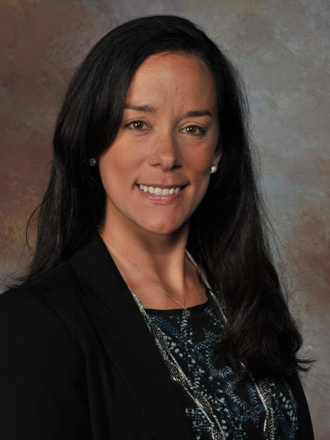 Portrait of Kori Doring, a Coach Club golf coach